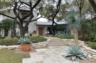 A limestone entry walk with agaves and yucca